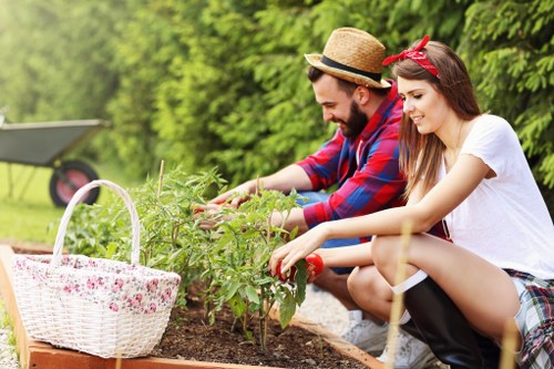 Local gardeners tending to plants in a vibrant garden