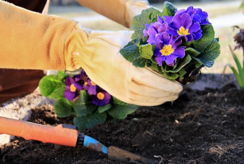 Professional gardeners at work in a residential garden in Cowley.